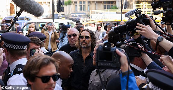 LONDON, ENGLAND - MAY 02: Russell Brand arrives at Westminster Magistrates' Court on May 02, 2025 in London, England. The charges relate to accusations of rape, indecent assault and sexual assault between 1999 and 2005. (Photo by Neil Mockford/Getty Images)