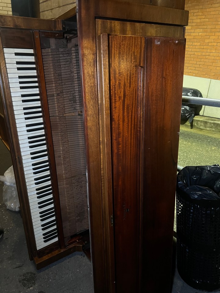 A discarded upright piano.