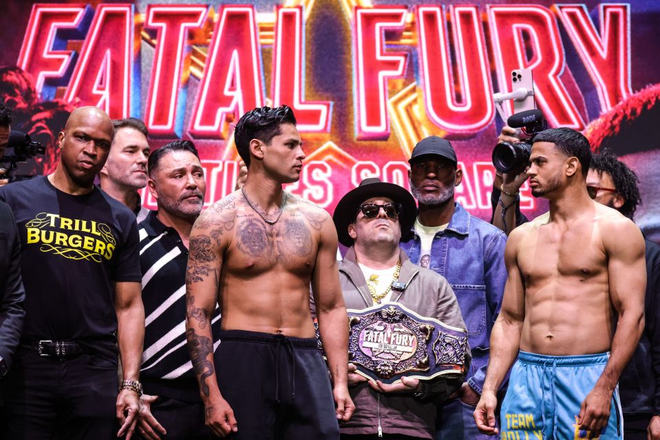Ryan Garcia and Rolando Romero facing off at a weigh-in.