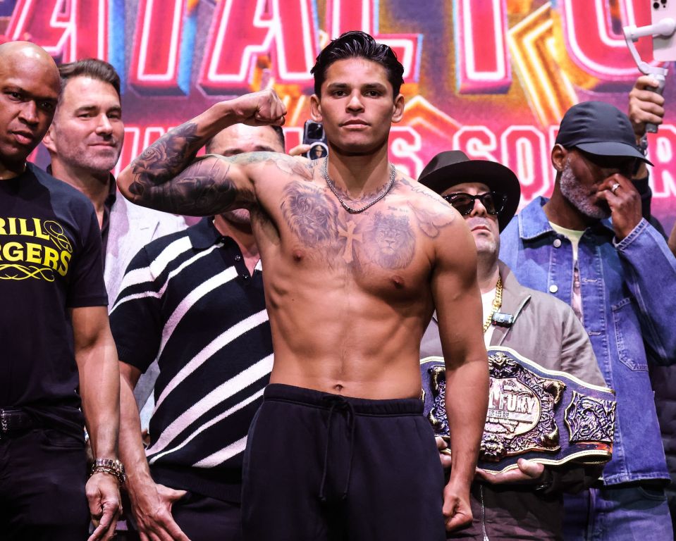 Ryan Garcia flexing at a boxing weigh-in.