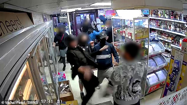 The brutal attack that lasted 16 minutes happened in front of a customer who was forced to watch in horror as the gang repeatedly punched and kicked the worker