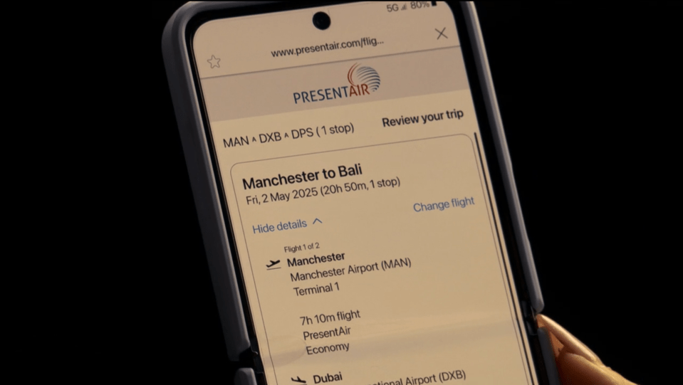 Smartphone displaying a flight itinerary from Manchester to Bali.