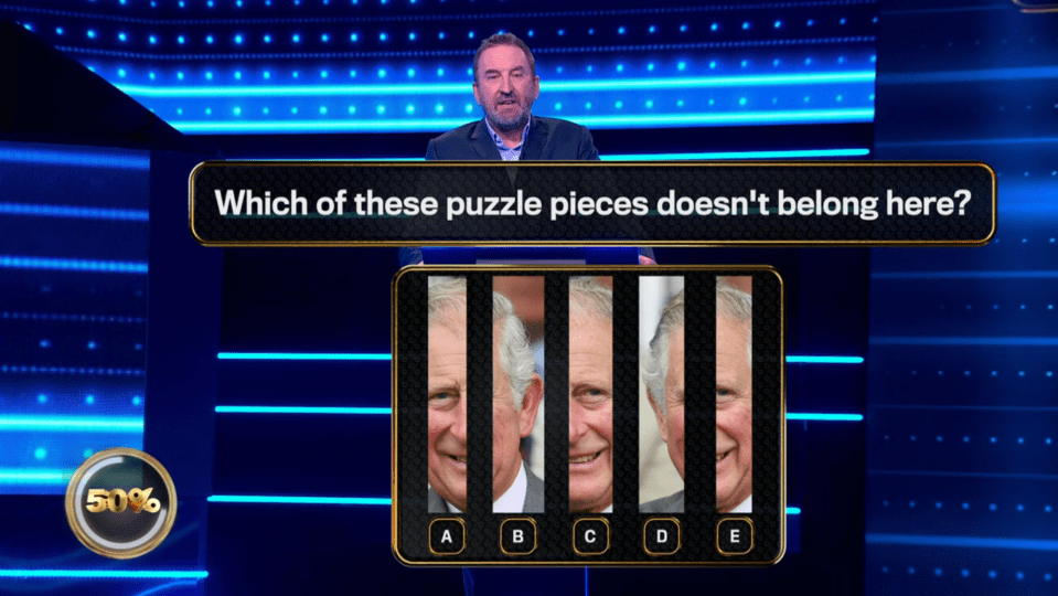 Screenshot of a game show question: Which of these puzzle pieces doesn't belong here?  Five images of King Charles III are shown, one differing slightly from the others.