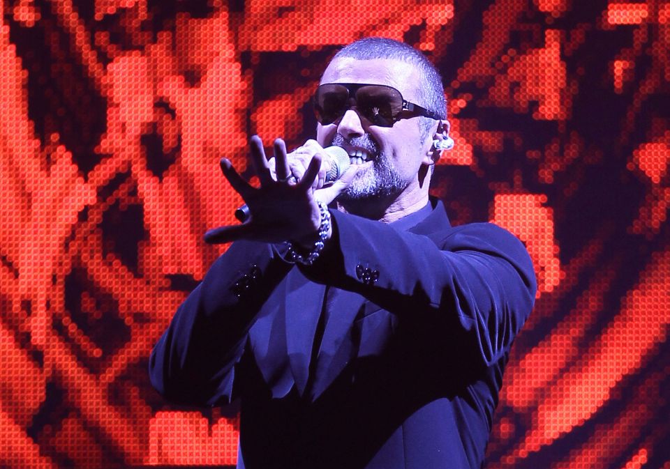 George Michael performing on stage.