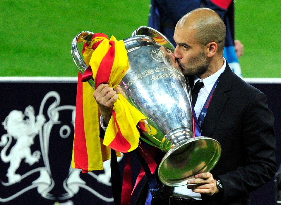 Pep Guardiola kissing the UEFA Champions League trophy.
