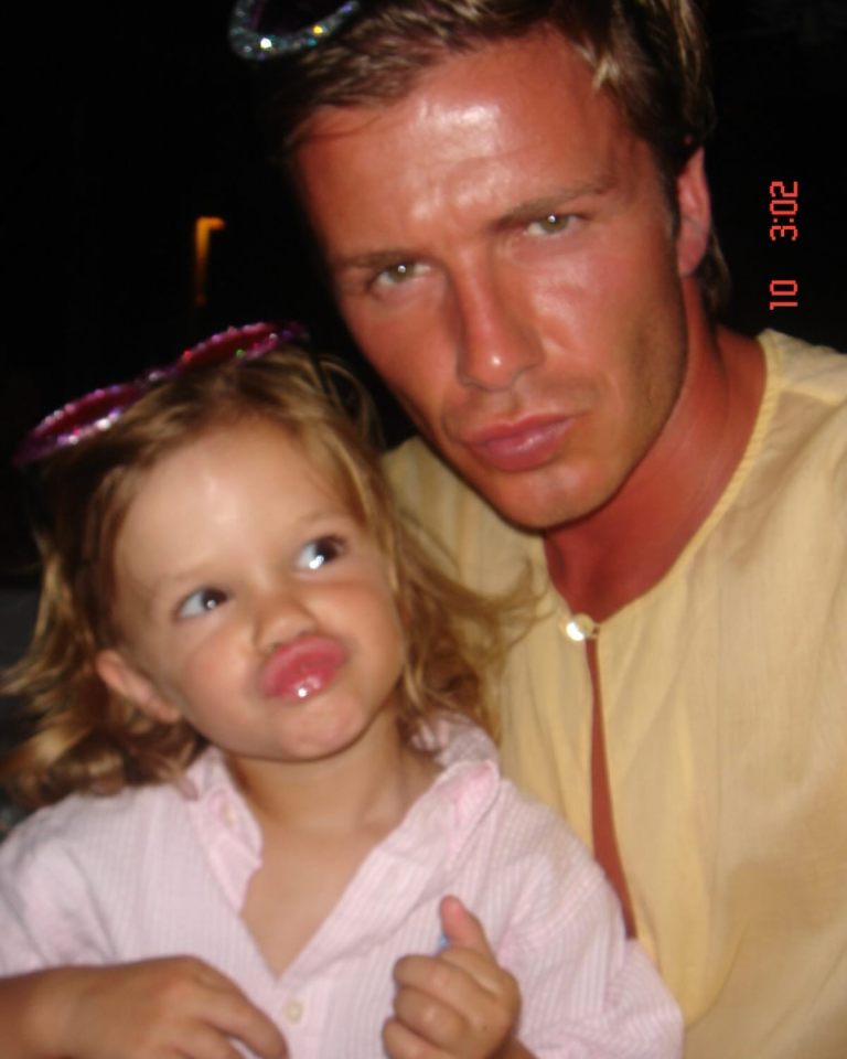 David Beckham and his young daughter making funny faces.