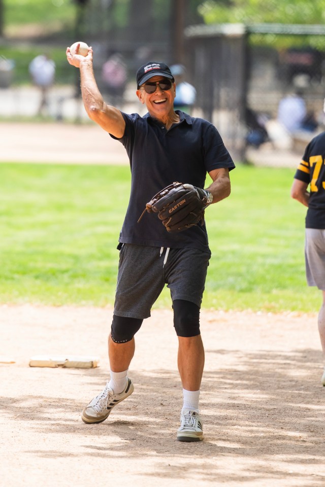 George Clooney playing softball in Central Park.