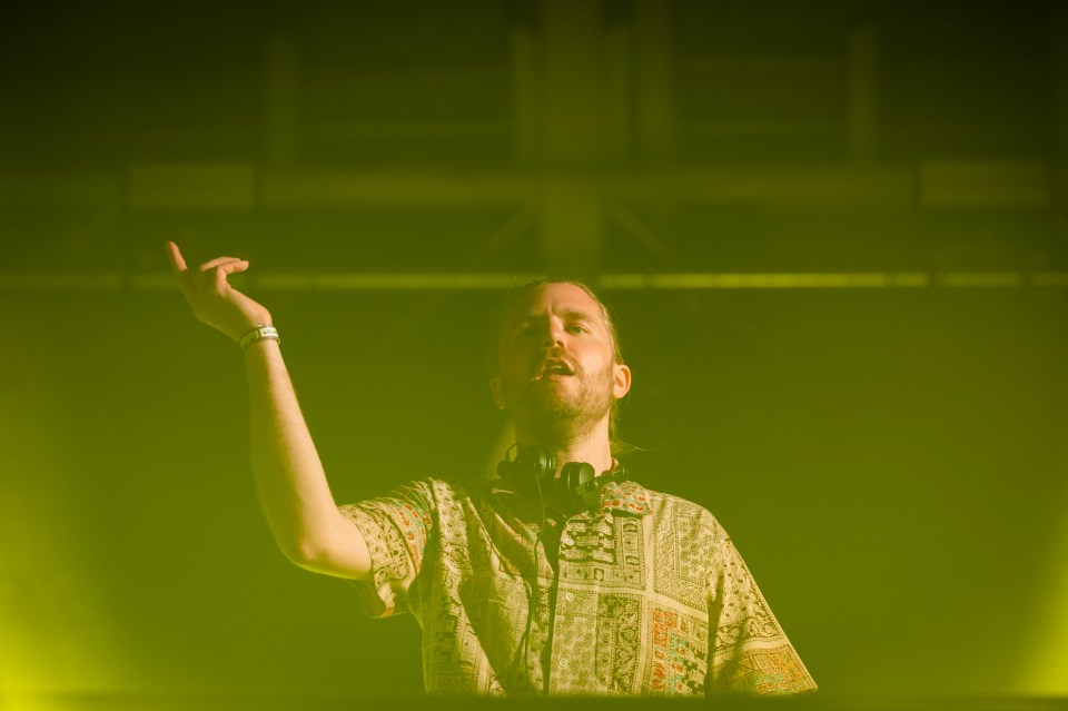 Sub Focus performing on stage at a music festival.