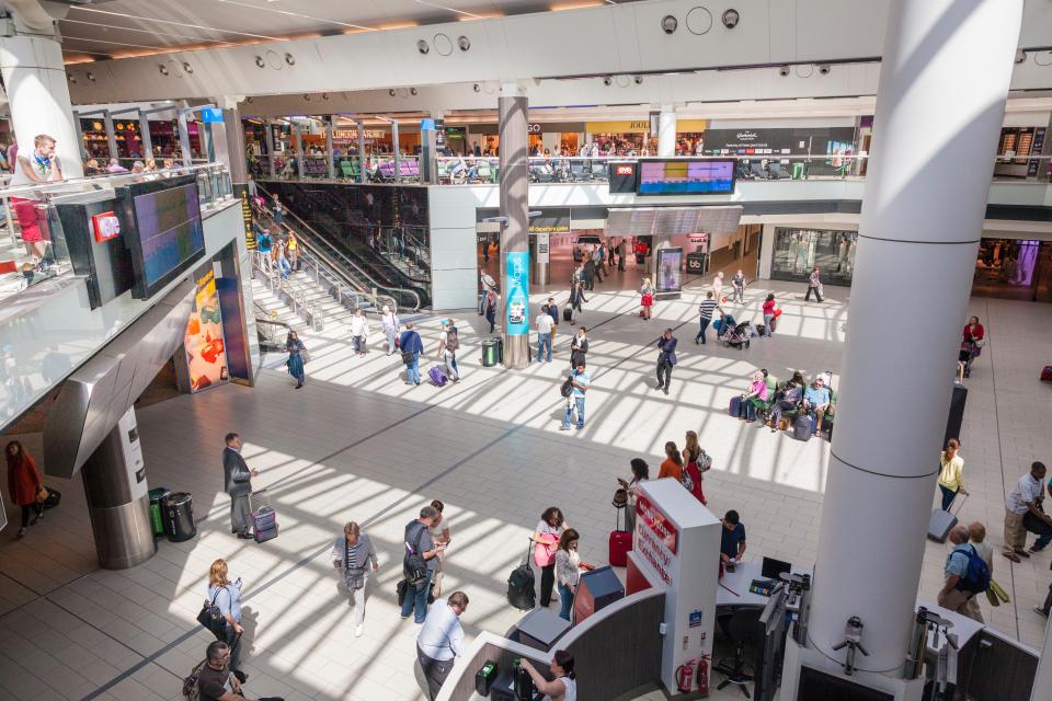 Gatwick Airport South Terminal departure hall with passengers.