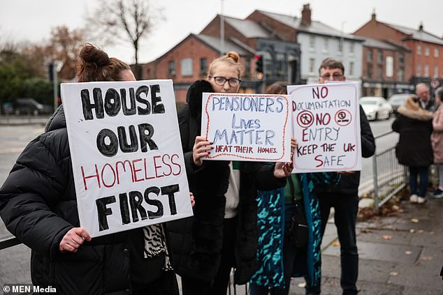 A worried group previously gathered in Manchester to protest against asylum seekers being housed locally