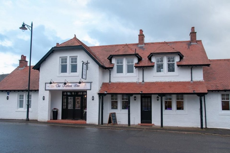 The Kirkton Inn, a white building with a red tile roof.