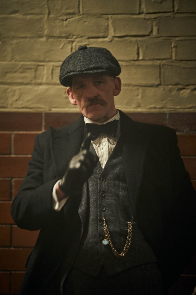 Arthur Shelby from Peaky Blinders gesturing.