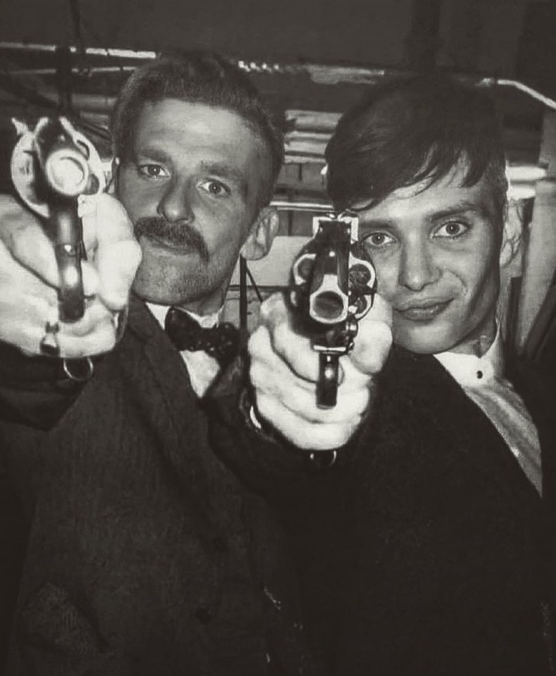 Black and white photo of Cillian Murphy and Paul Anderson on the set of Peaky Blinders.