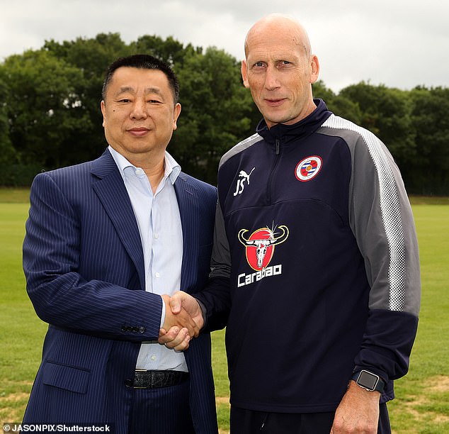 Dai Yongge's eight years as owner have seen the team managed by eight managers, including former Manchester United defender Jaap Stam (right, with Dai)
