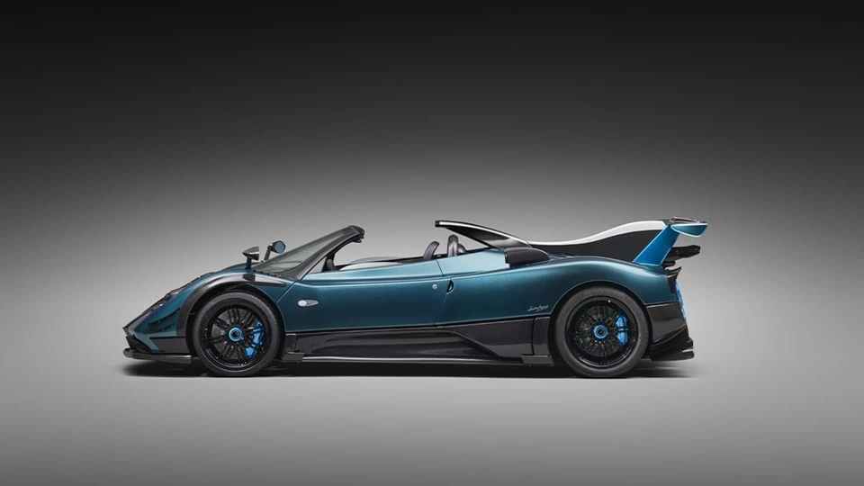 Side profile of a blue Pagani Zonda convertible.