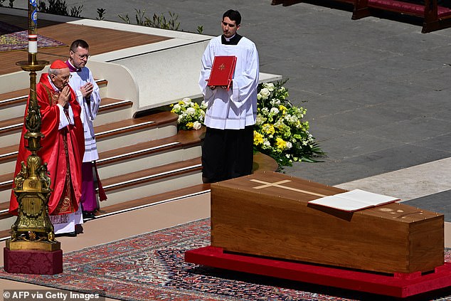 Italian cardinal Giovanni Battista Re (L) officiates the mass in front of the coffin of late Pope Francis, during the funeral ceremony at St Peter's Square at the Vatican on April 26, 2025