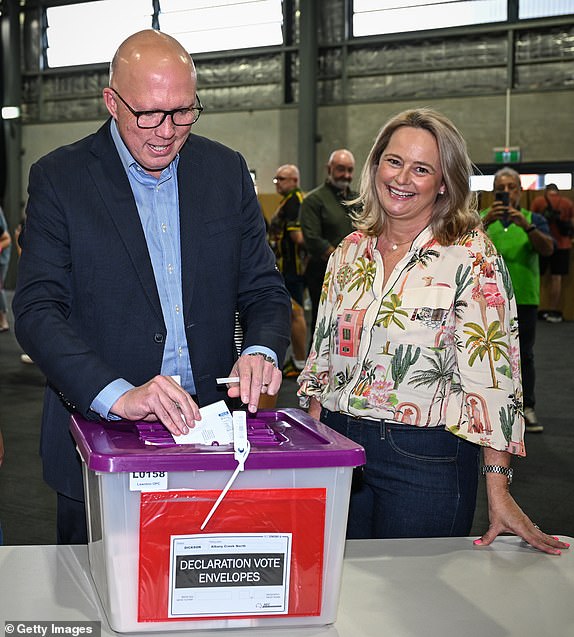BRISBANE, AUSTRALIA - MAY 03: Opposition Leader Peter Dutton casts his vote with his wife Kirilly at the Albany Creek state school on May 03, 2025 in Brisbane, Australia. Australians will vote on Saturday in a federal election that will decide the next government and shape the nation's direction on key issues like housing, cost of living, energy and healthcare. The election comes when international relations are fraught and will be watched closely globally. (Photo by Dan Peled/Getty Images)