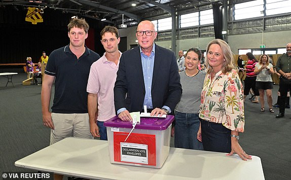 Leader of the Opposition Peter Dutton casts his ballot with his family at the Albany Creek State School in Albany Creek, Brisbane, Australia, May 3, 2025. AAP Image/Mick Tsikas/via REUTERS ATTENTION EDITORS - THIS IMAGE WAS PROVIDED BY A THIRD PARTY. NO RESALES. NO ARCHIVE. AUSTRALIA OUT. NEW ZEALAND OUT. NO COMMERCIAL OR EDITORIAL SALES IN NEW ZEALAND. NO COMMERCIAL OR EDITORIAL SALES IN AUSTRALIA.