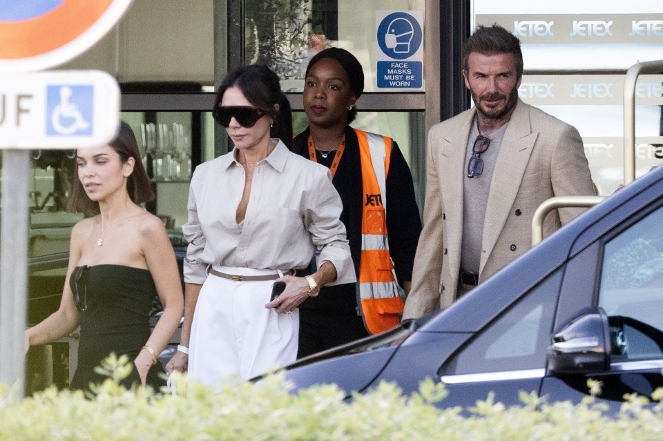 The Beckham family arriving at an airport.