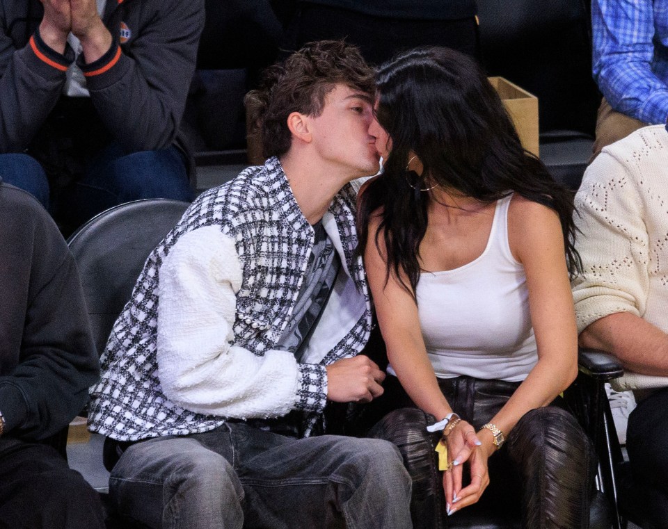 Timothée Chalamet and Kylie Jenner kissing at an NBA playoff game.