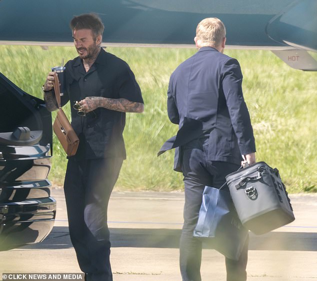 He showed off his array of arm inkings while carrying a reusable cup, leather handbag and shades