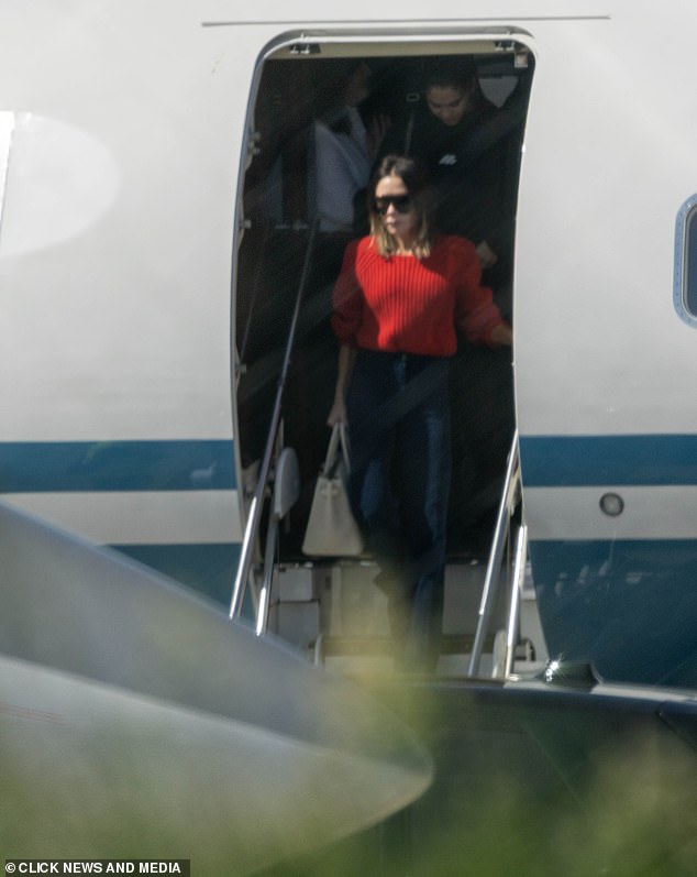 Victoria finished her look with a pair of large shades as she struck a serious expression