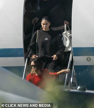 Meanwhile Kim kept it casual in a black sweatshirt