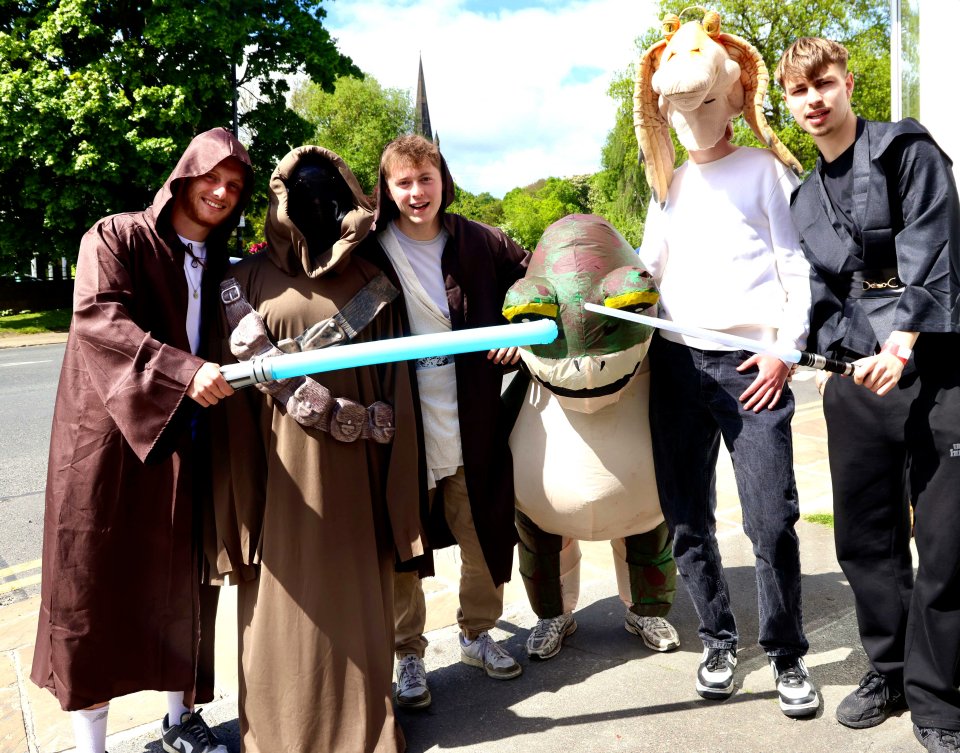 Group of people in Star Wars costumes.