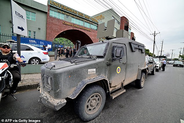A military vehicle stands guard at a polling station during the presidential runoff election in Guayaquil, Guayas province, Ecuador, on April 13, 2025