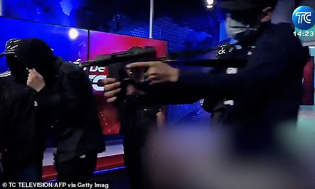 Armed men wearing balaclavas bursting into the studio of public television station TC in drug violence-torn port city of Guayaquil