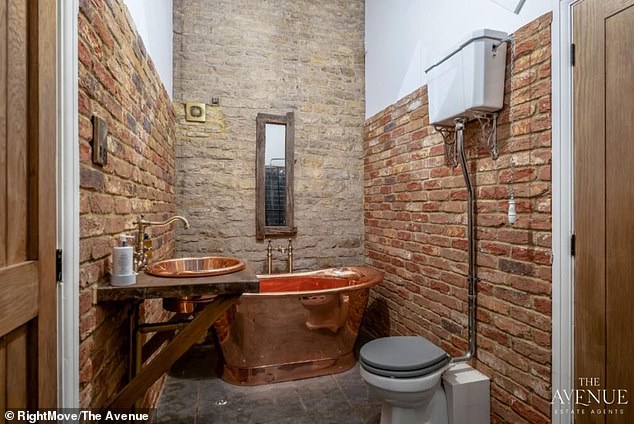 An image shows how the church has been renovated to include its own bathroom - with a bronze coloured tub and sink