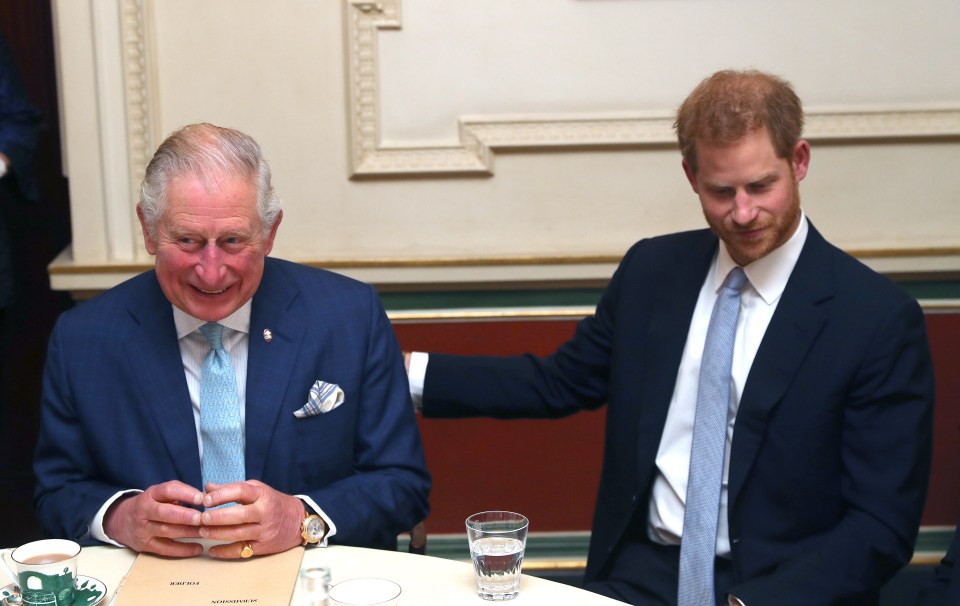 King Charles III and Prince Harry at a meeting.