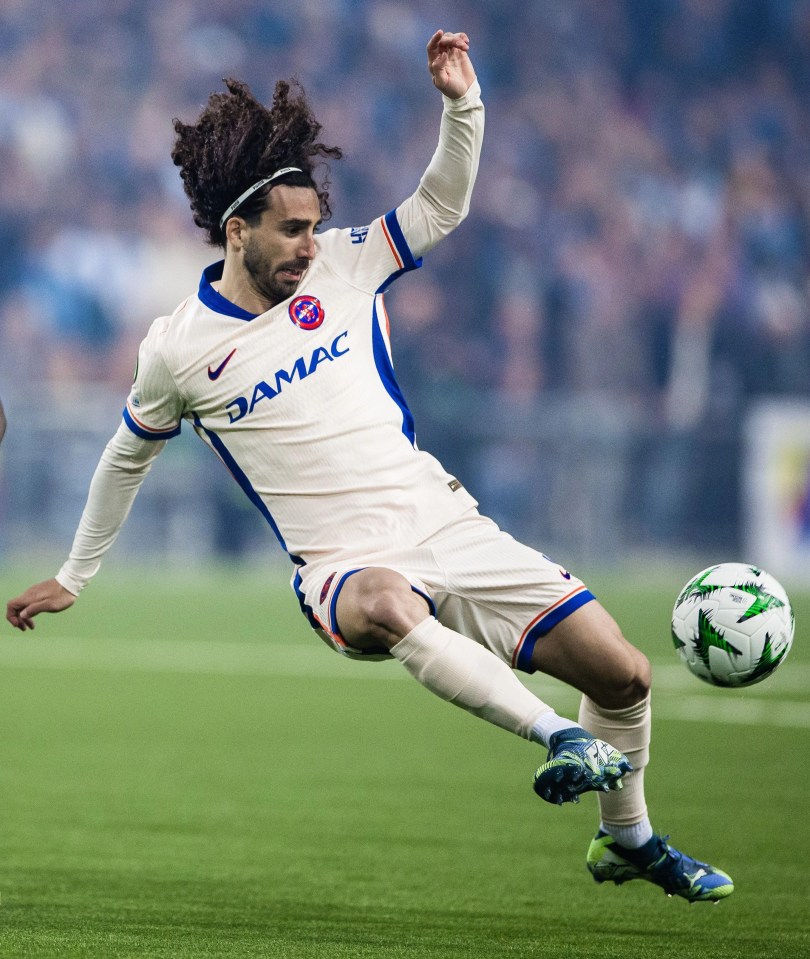 Marc Cucurella of Chelsea kicking a soccer ball.