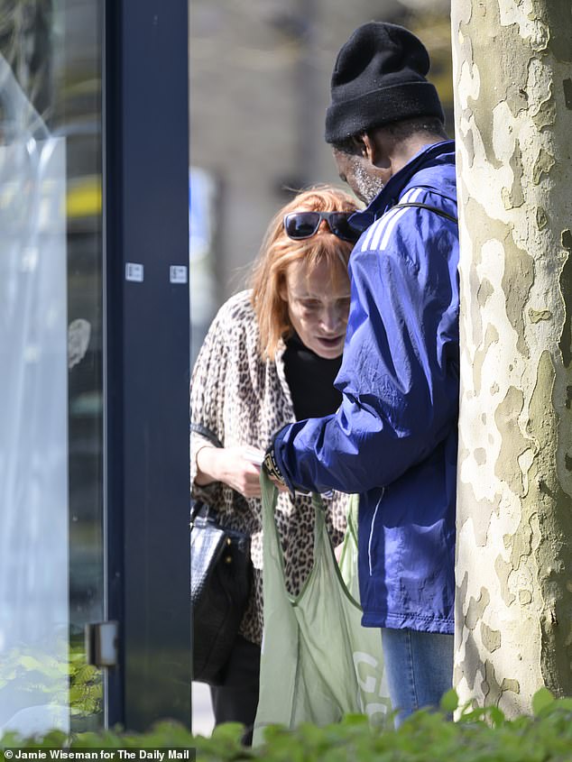 Ndam pictured showing Sue some of the bottles he collected for his pocket money