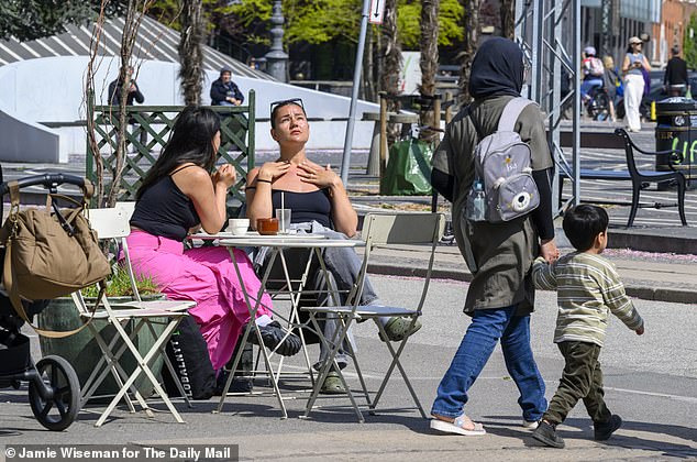 People in the 'hip' district of Norrebro in Copenhagen - which was once considered a ghetto