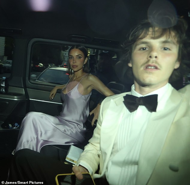 Cruz cut a suave figure in a white tuxedo while Jackie looked elegant in a purple satin gown