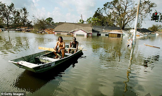 Louisiana is essentially one big swamp, and flooding is rampant. Its climate means thunderstorms and hurricanes are fairly common, too. Pictured: Two men paddle in high water after Hurricane Katrina devastated the area August 31, 2005 in New Orleans, Louisiana