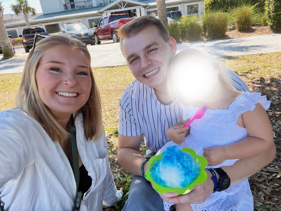 Family enjoying shaved ice outdoors.