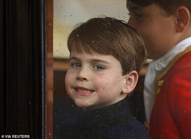 Louis wears a navy blue outfit from Savile row tailors Dege and Skinner for the two-hour long ceremony