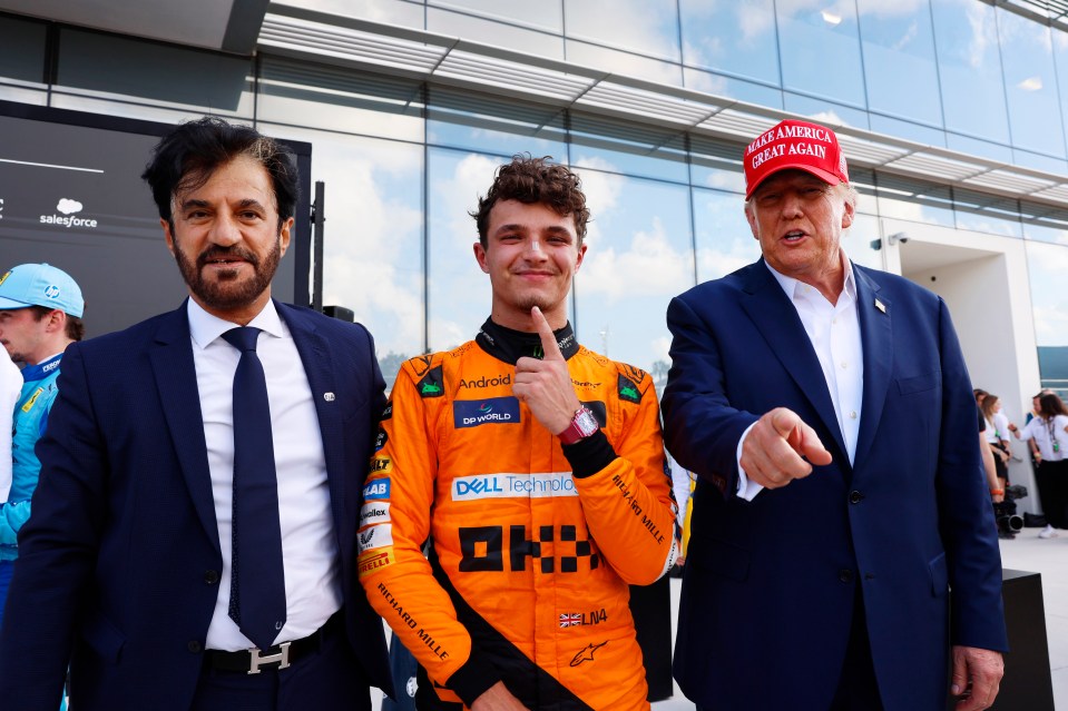 Donald Trump speaking with McLaren CEO Zak Brown in the McLaren garage.
