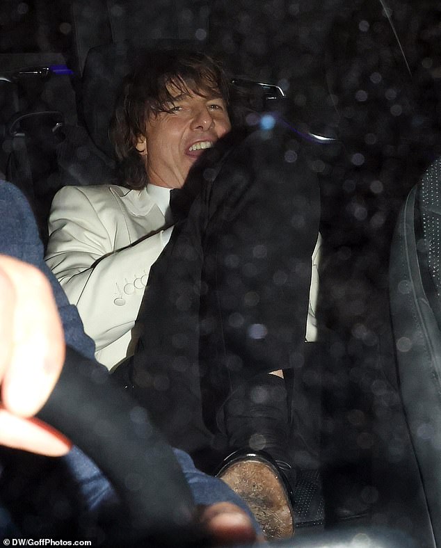 They ducked down behind the car seats as they sat together in the back of the vehicle before heading off