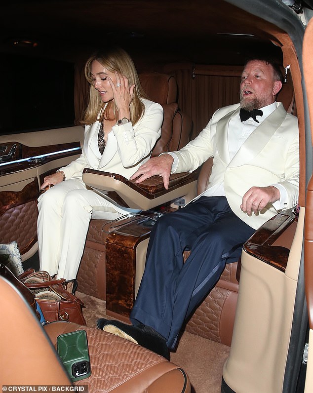 Guy Ritchie and Jacqui Ainsley pictured in the back of a taxi after the party