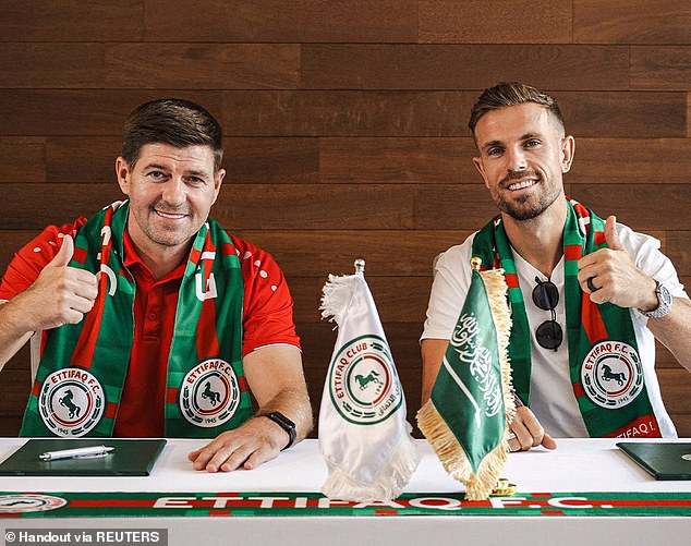 Steven Gerrard and Jordan Henderson are seen during the latter's signing by Al-Ettifaq. The former Liverpool team-mates both elected to stay in Bahrain while at the club