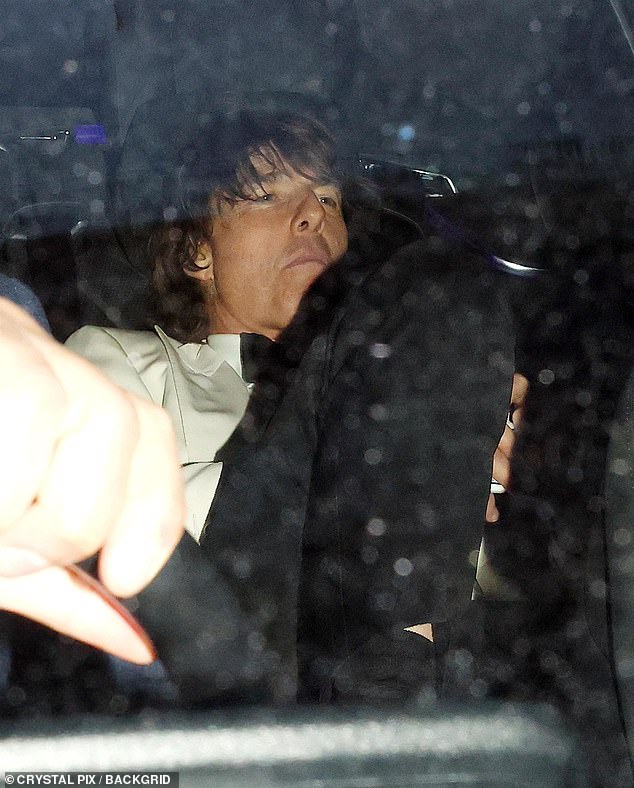 Tom hopped into the back of a cab as he left