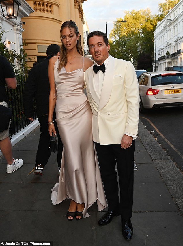 Dave Gardner, 47, also opted for a white tuxedo, as he posed for a picture with stunning Victoria's Secret model girlfriend Jessica Clarke, 31