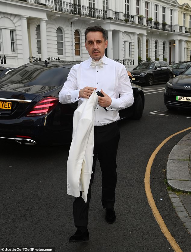 Football pundit Gary Neville, 50, dressed to impress in a dashing white tuxedo as he was one of the first to arrive