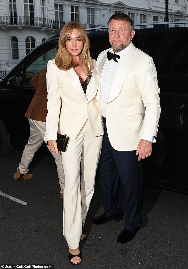 Guy Ritchie and his glamorous wife Jacqui Ainsley opted for matching white ensembles