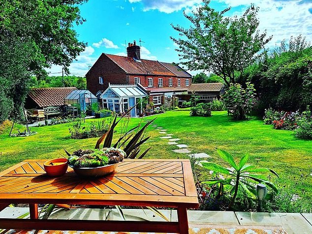 Guests could sit on their private patio and relax while looking across the picture perfect garden