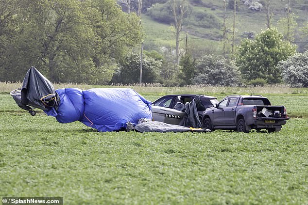 Volunteers have been spotted protecting a historic 1940s-era Spitfire that landed in a crop field near Hythe, Kent