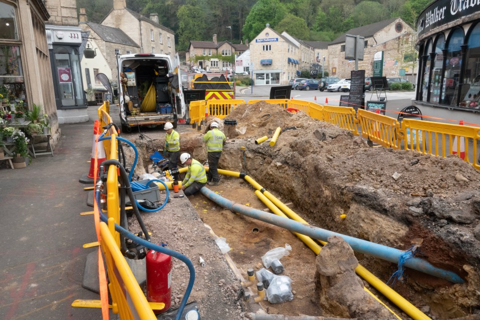 Workers repairing a damaged gas main in Nailsworth, Gloucestershire.